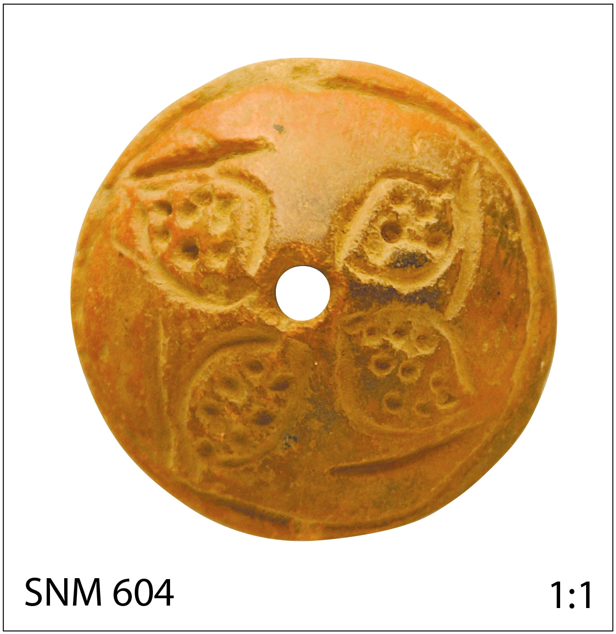 Ceramic spindle whorl from Meroe-city with pattern of a sorgho plant, from oven area M260. SNM 604 (photograph E. Yvanez, courtesy of the Sudan National Museum).